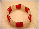 Lady's love trendy jewelry online shop wholesale red and white flat beads forming fashion stretchy bracelet. One size fits all. High quality is what we guarantee!